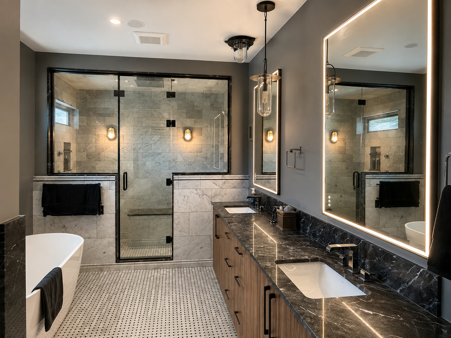 Custom glass shower enclosure and illuminated mirrors in a residential bathroom